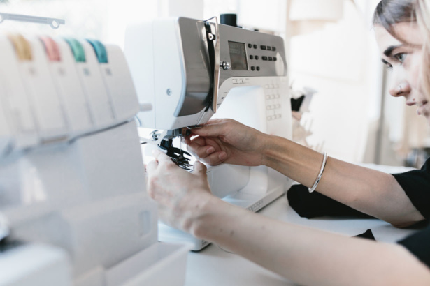 state of making - stock photo of woman sewing
