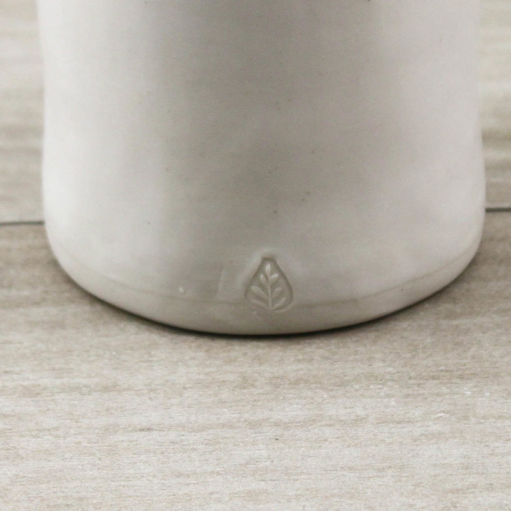 Brand mark in base of ceramic vessel