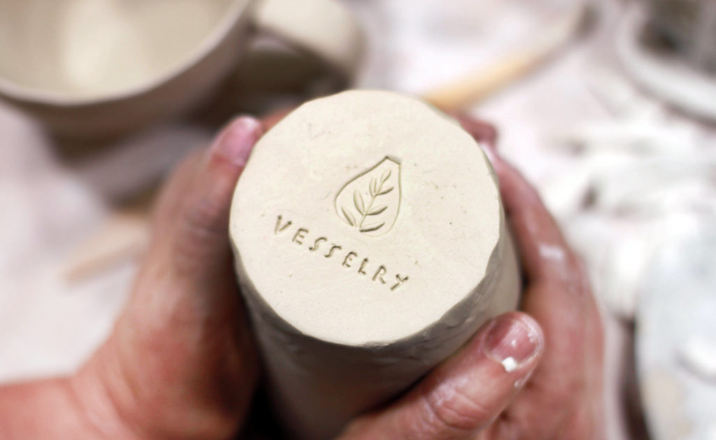 Logo debossed on the bottom of ceramics. Custom logos are just one of the illustration types that we offer.