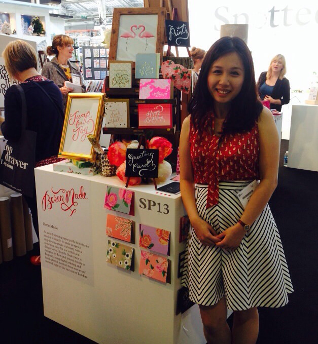 Trade show exhibitor at her stationery display