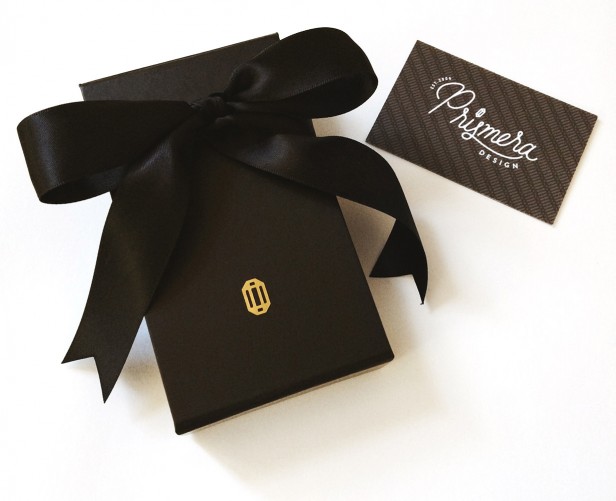 Prismera jewelry packaging featuring their modern jewelry logo 