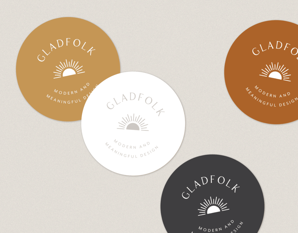 Gladfolk round sticker design with logo and black, brown, gold, and white versions.