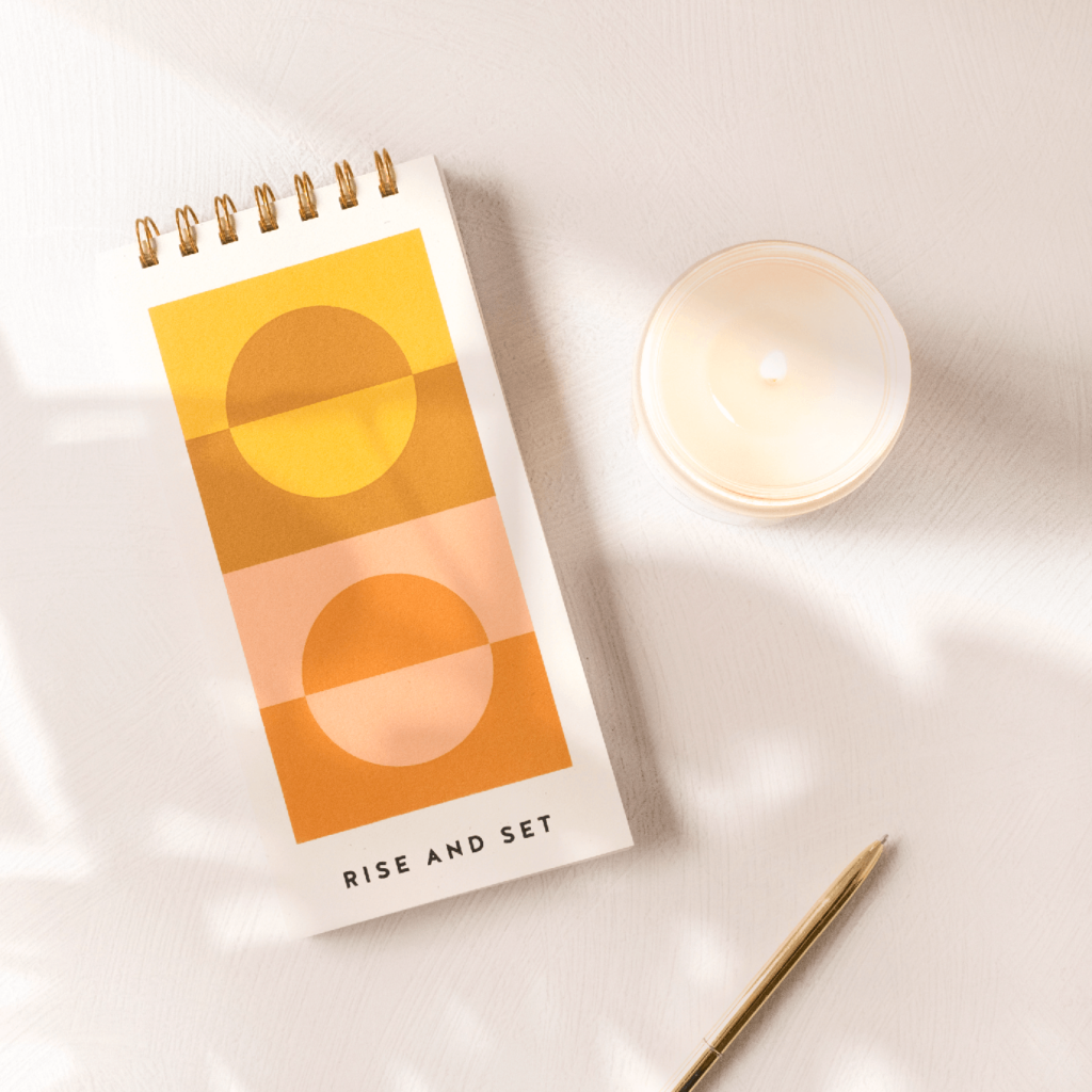 Gratitude journal and candle set by Worthwhile Paper. Read the full interview with artist and business owner Kristen Drozdowski. She shares her business journey and reflects on hiring Aeolidia to design her stationery website.