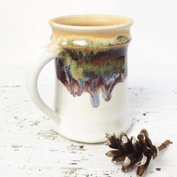 Styled photo of a handmade mug by ceramic artist Lee Wolfe