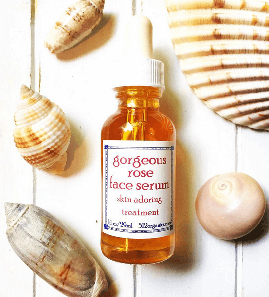 styled photo of face serum and seashells